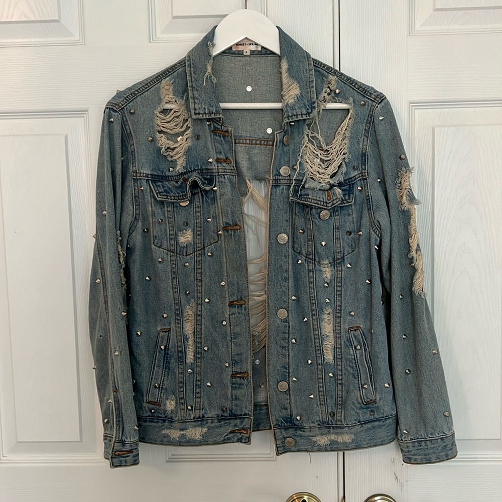 Studded, distressed denim jacket